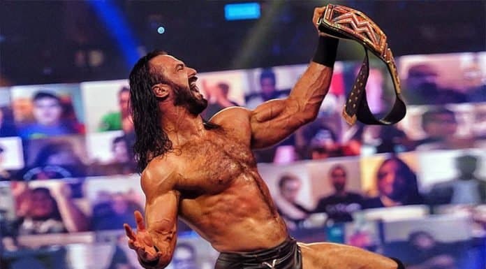 Drew McIntyre celebrates defeating Randy Orton for the WWE title.